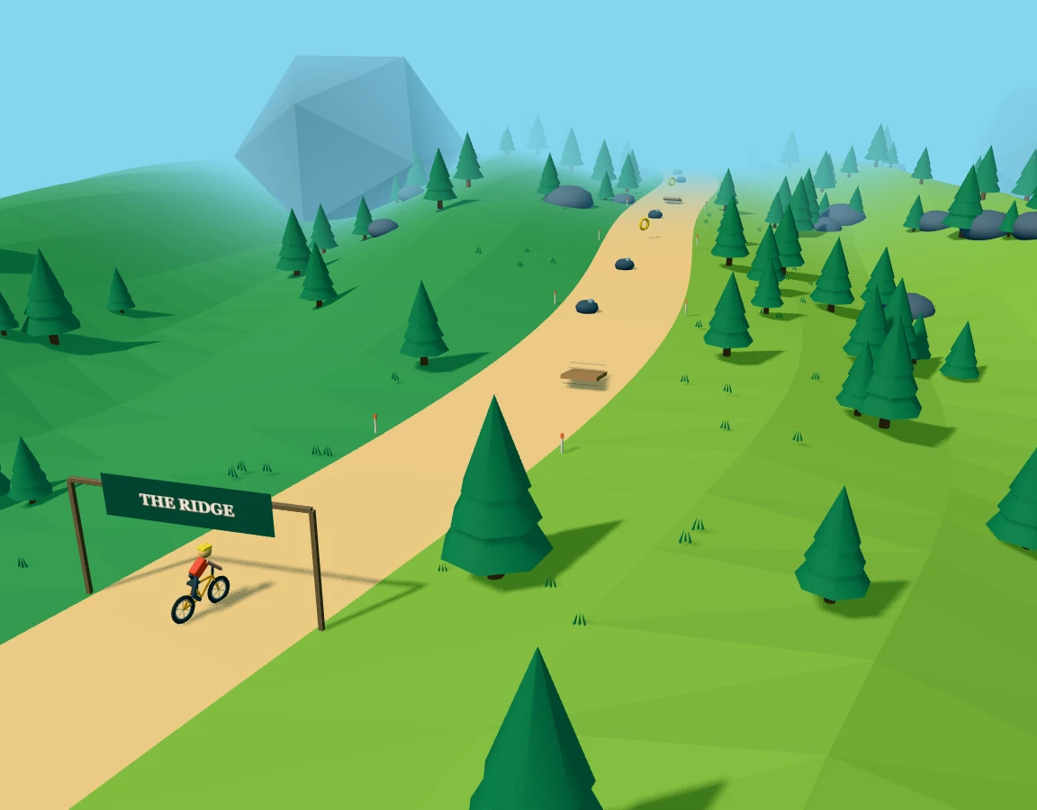 A mountain bike at the start of a pine-lined downhill trail